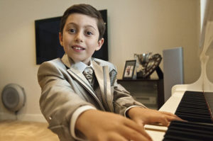 Kid playing piano